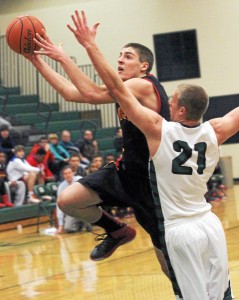 Penncrest's Ben Casanova, left, drives to the basket past Ridley's Pat O'Neill during their Central League game Thursday. (Robert J. Gurecki)